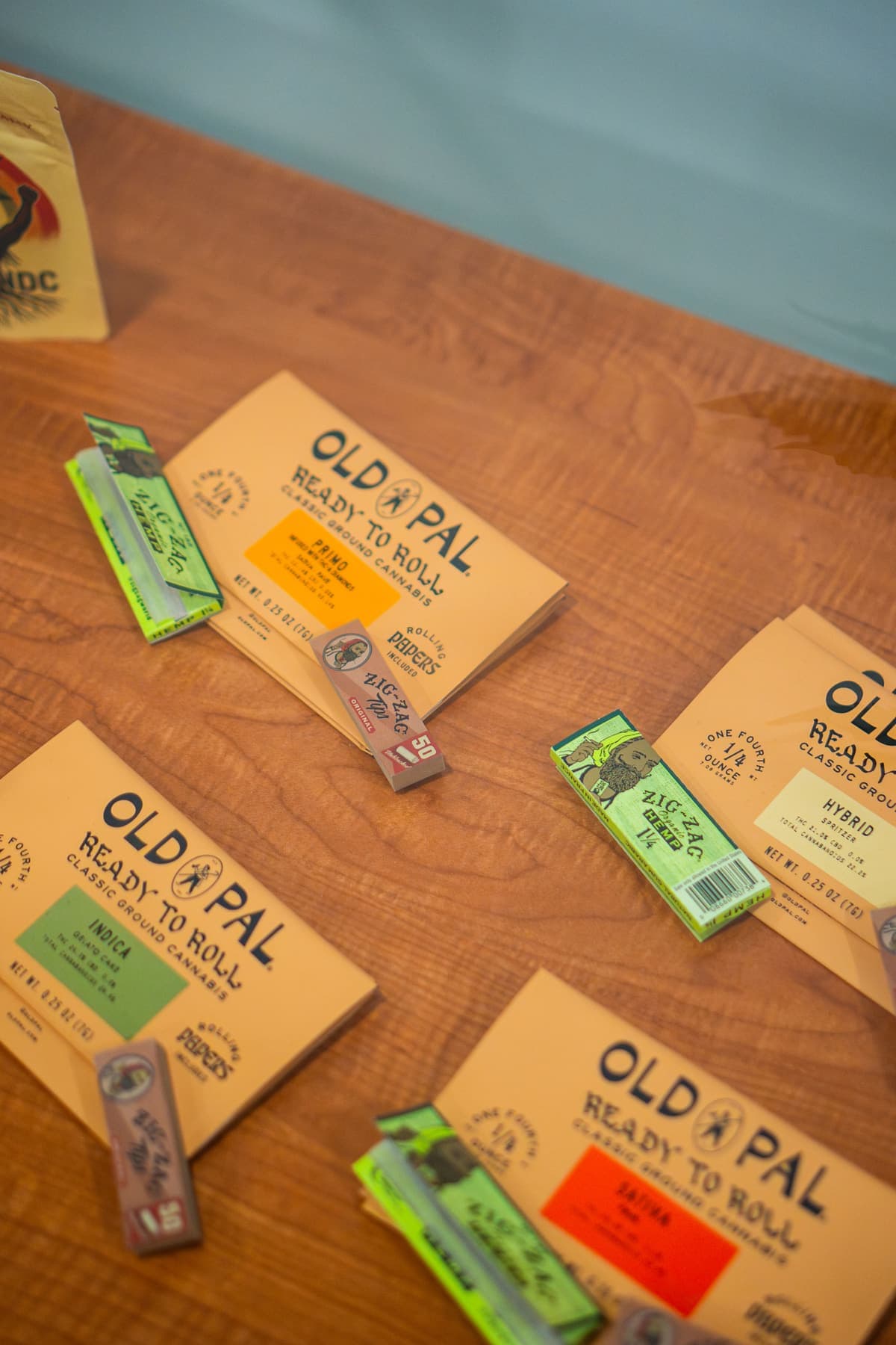 Rolling papers and cones laid out on the wood counter